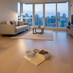 A modern living room with light wood flooring, featuring a beige sofa, a low wooden coffee table on a cream rug, and a slow feeder set.