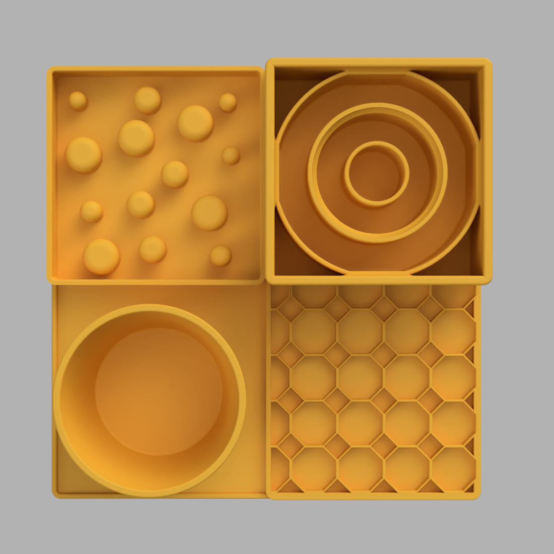 A yellow slow feeder set on a light gray background, featuring a bowl, a tray with small raised spheres, a spiral insert, and a hexagonal grid mat.