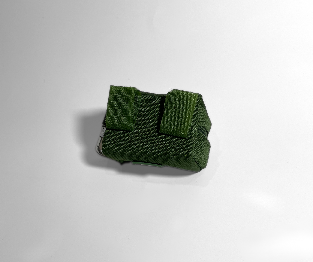 Green fabric strap on a white background