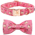 Pink dog collar and bow tie set with pumpkin pattern on a white background
