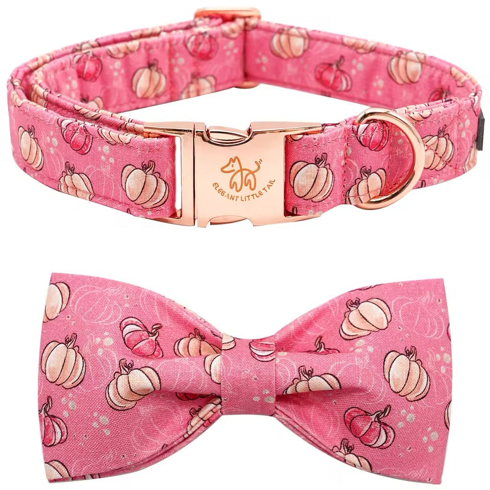 Pink dog collar and bow tie set with pumpkin pattern on a white background