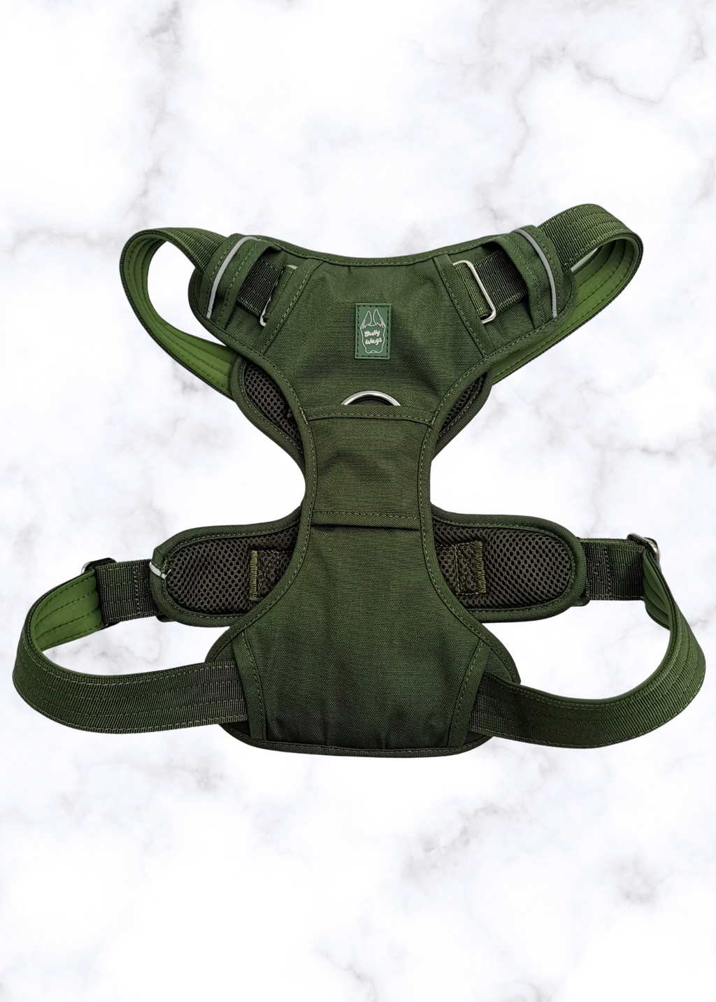 Green dog harness on a light gray background