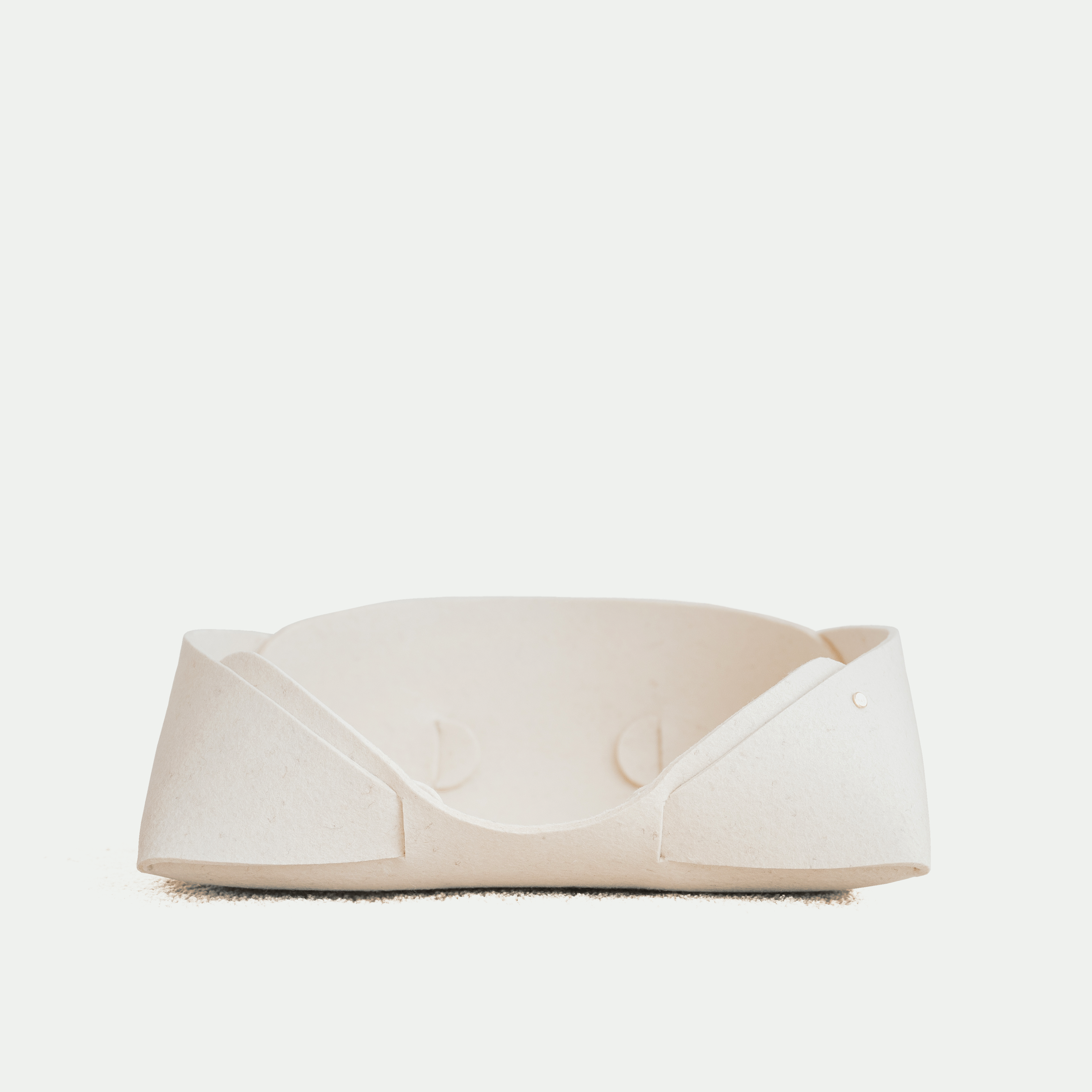 White pet bed on a white background