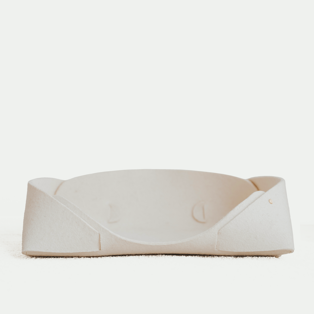 White pet bed on a white background