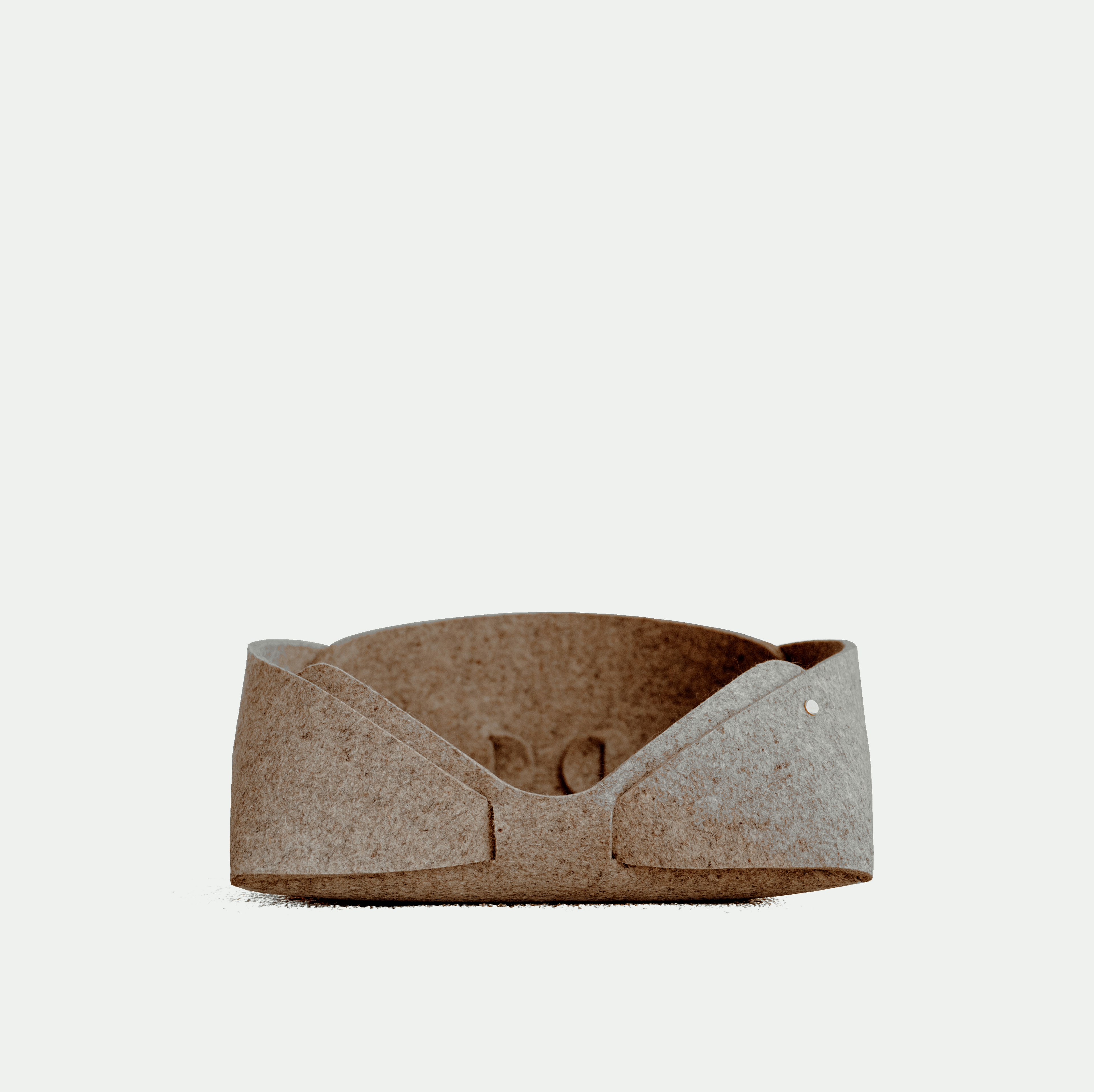 Brown felt pet bed on a white background