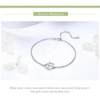 Silver bracelet with a heart-shaped clasp on a white background