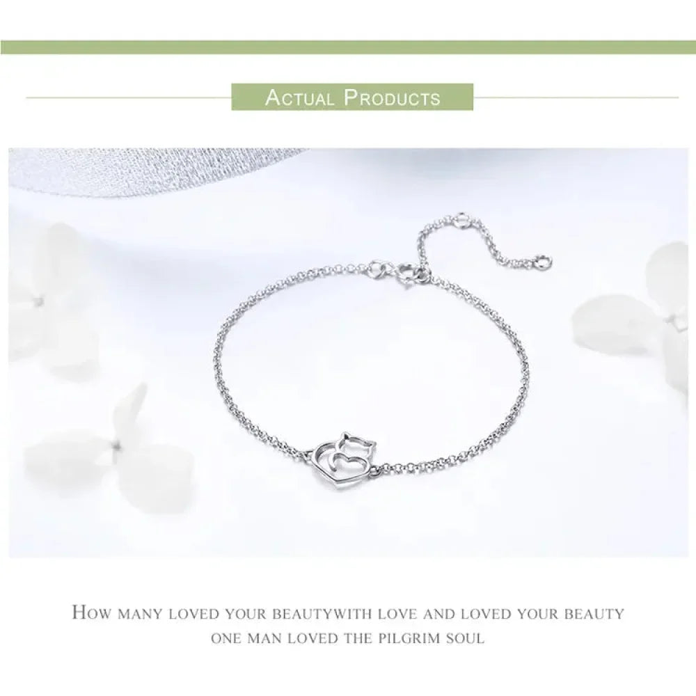 Silver bracelet with a heart-shaped clasp on a white background