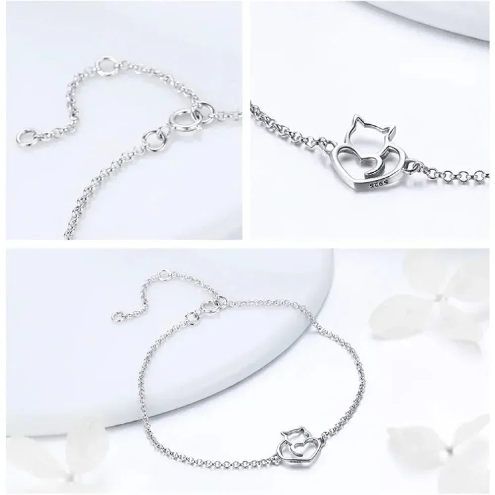 Silver bracelet with cat-shaped clasp on a white background