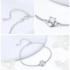Silver bracelet with cat-shaped clasp on a white background