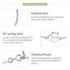 Information about oxidized silver jewelry with a heart-shaped clasp on a white background.