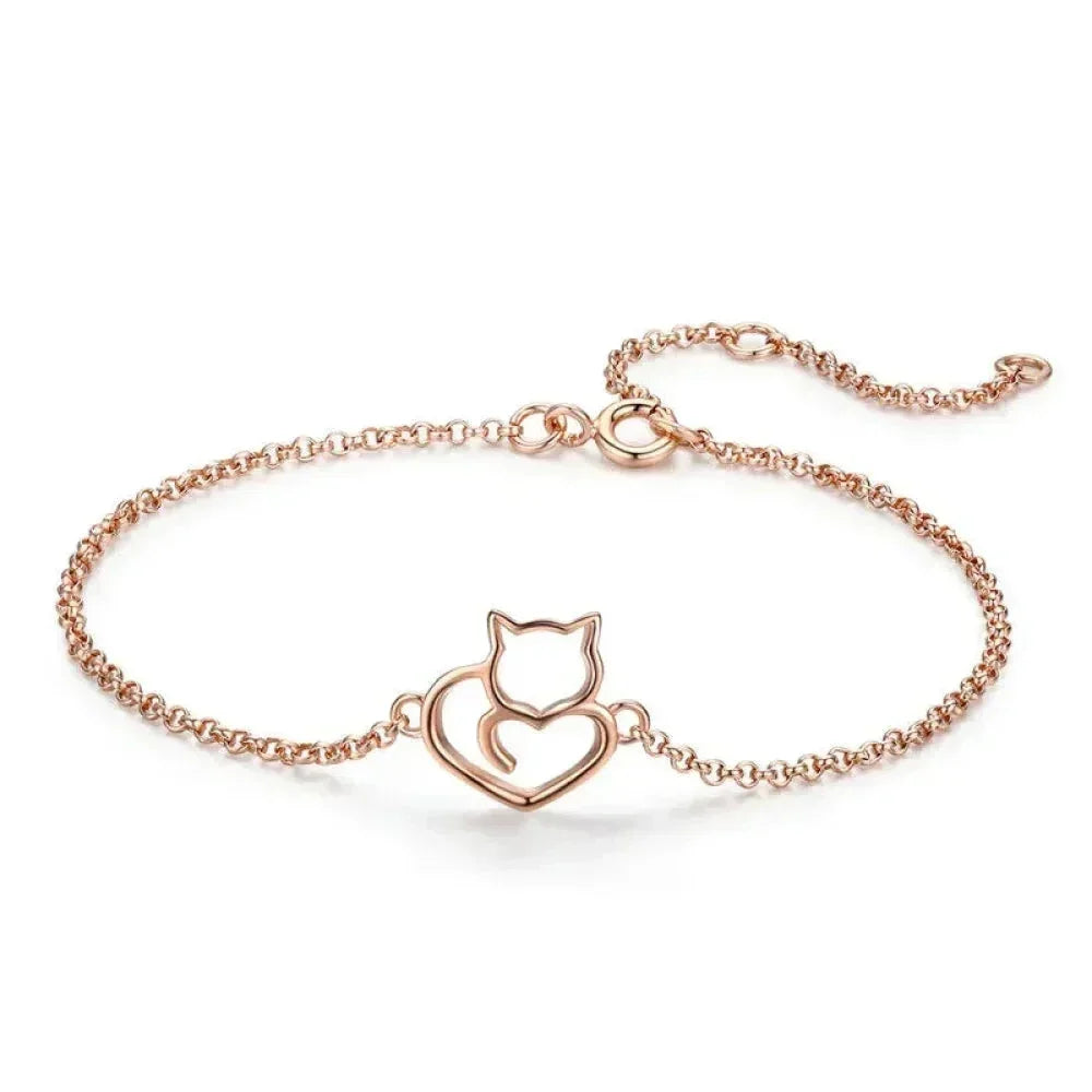 Rose gold bracelet with a cat-shaped clasp on a white background