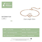 Rose gold bracelet with cat design on a white background