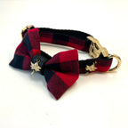 Red and black plaid dog collar with a bow tie and gold hardware on a white background