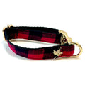 Red and black plaid dog collar with gold hardware on a white background