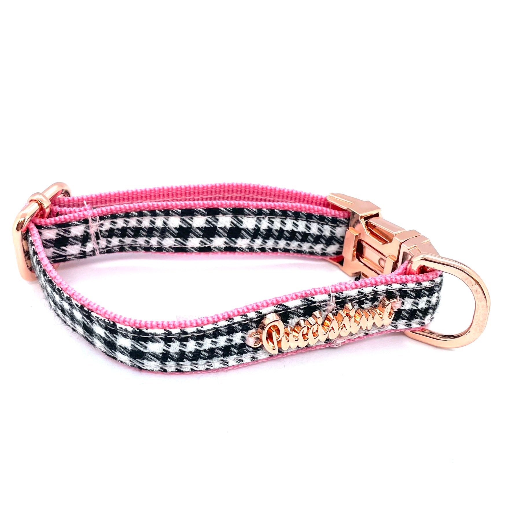 Dog collar with houndstooth pattern and pink accents on a white background
