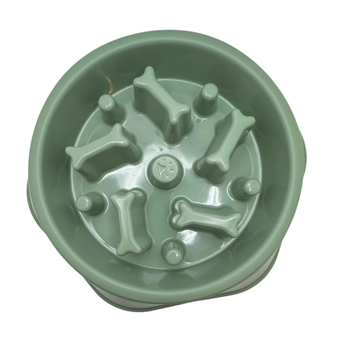 Green pet slow feeder bowl with bone-shaped protrusions on a white background