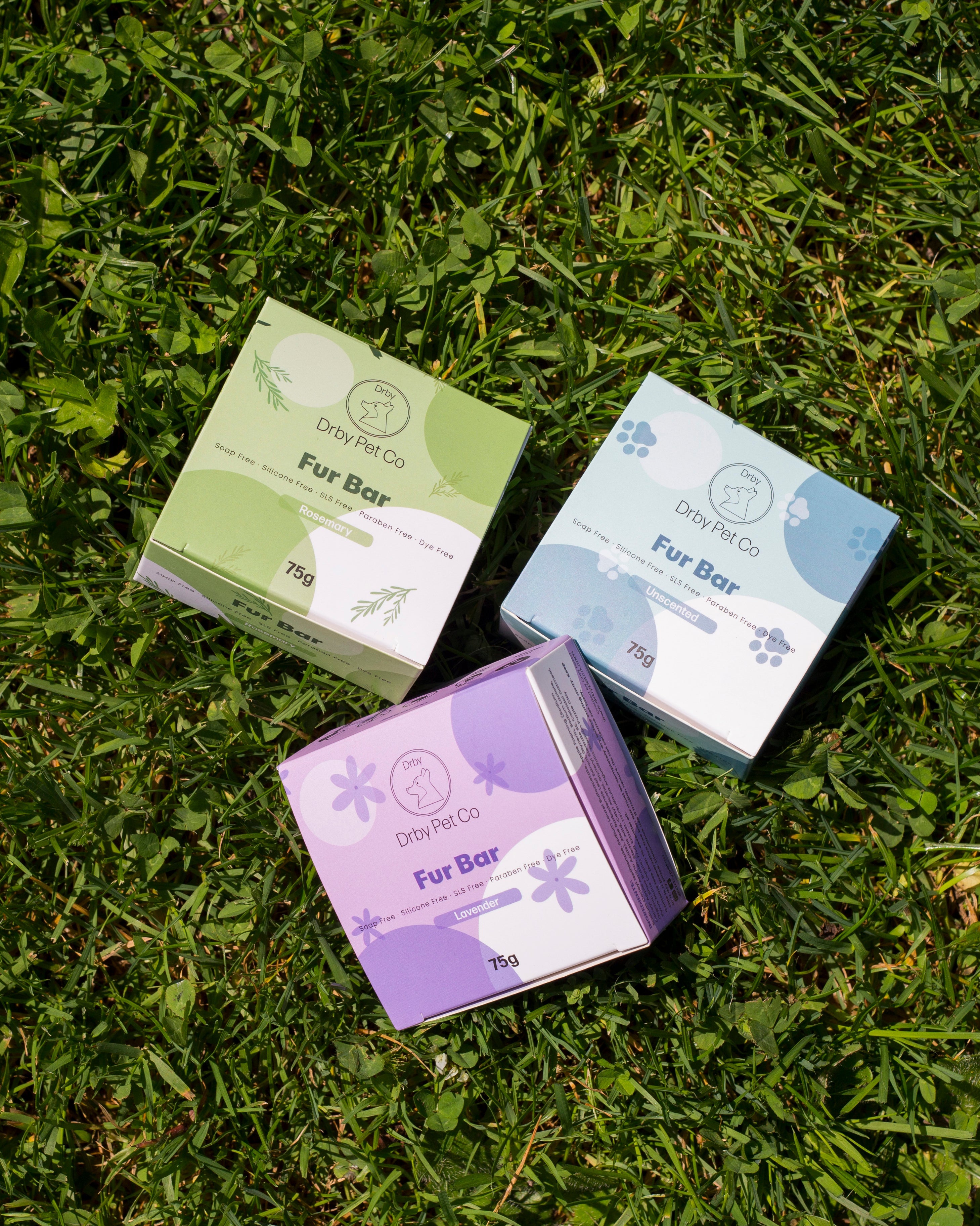 Three boxes of Drypet Co Fur Bar on grass