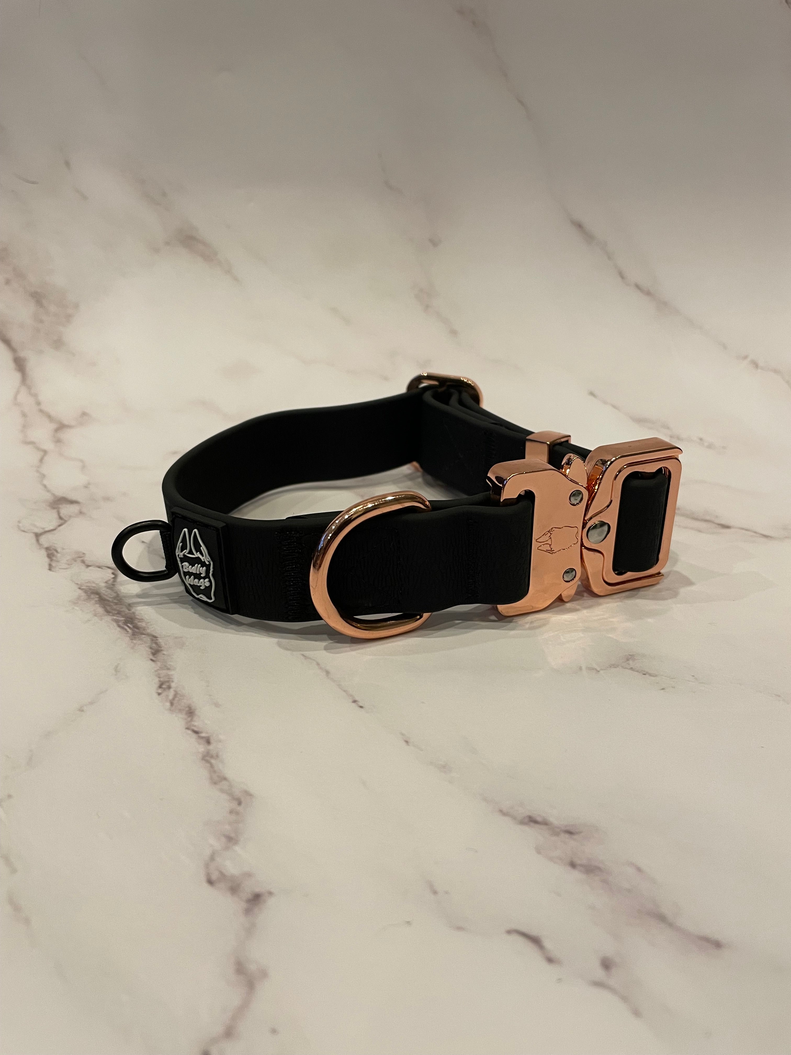 Black dog collar on a grey background