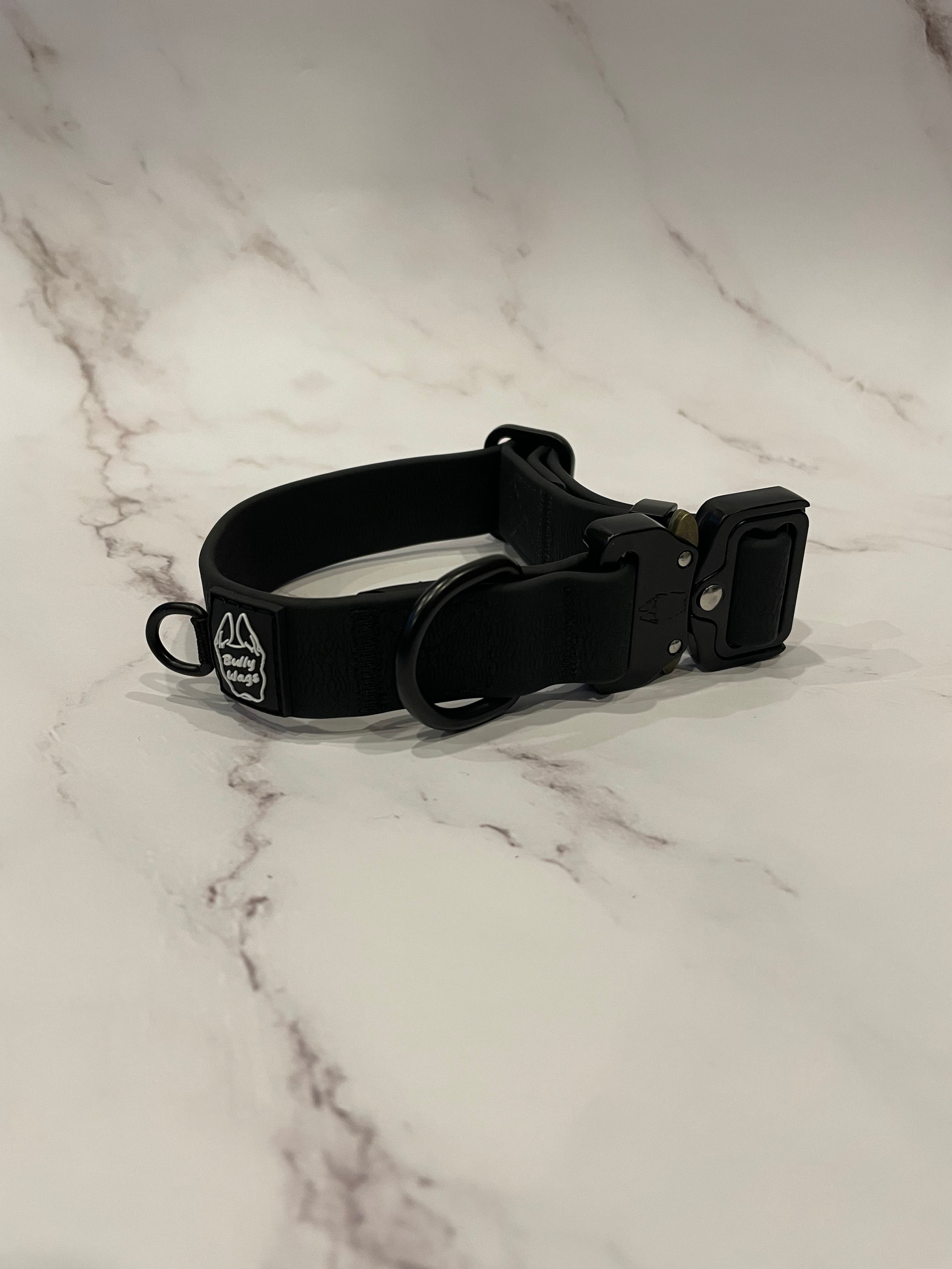 Black dog collar on a grey background