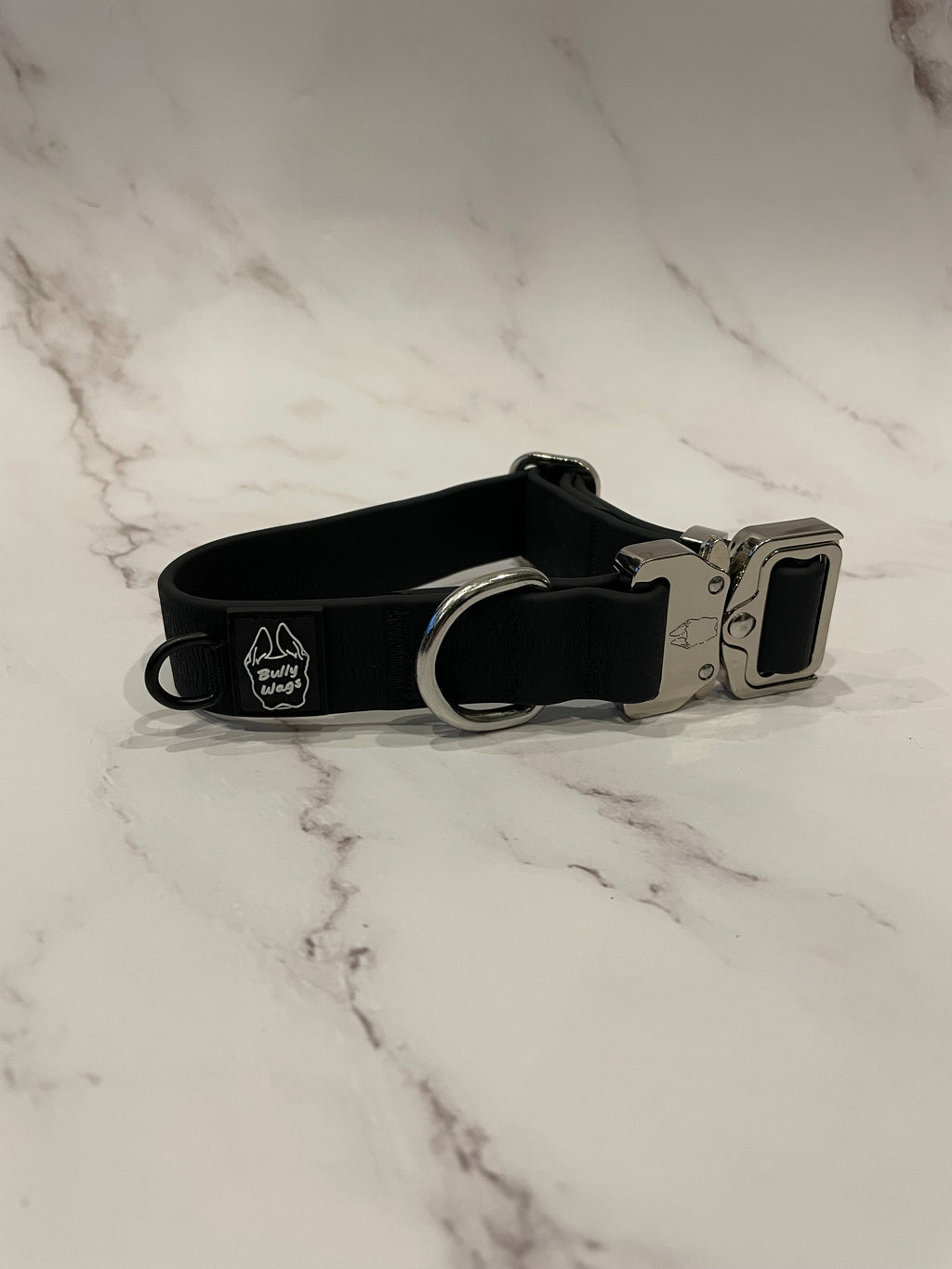 Black dog collar on a grey background