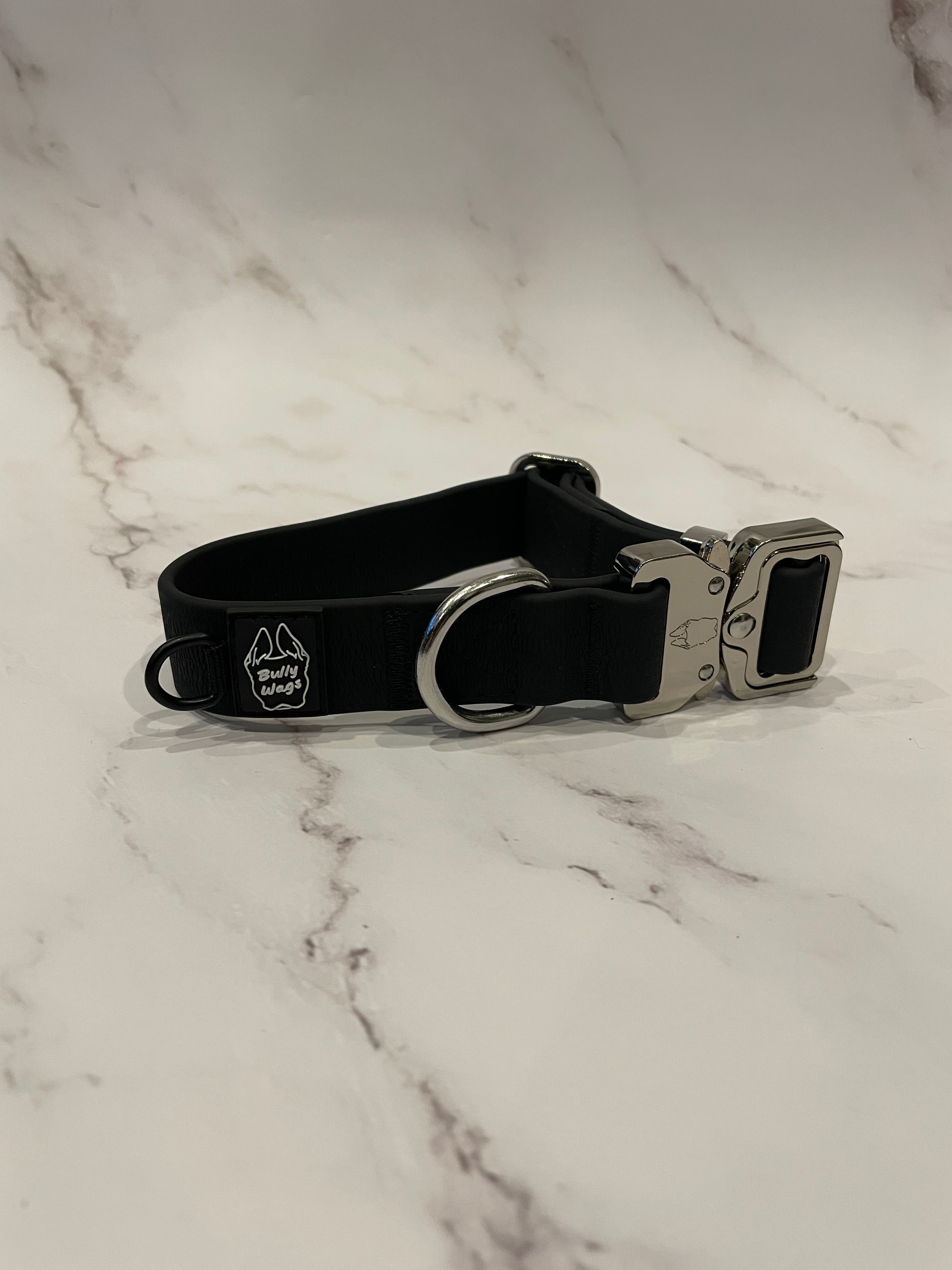 Black dog collar on a grey background