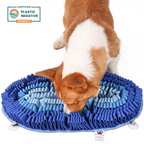 Dog playing with a blue circular mat on a white background, with a 'Plastic Negative' product certification logo.