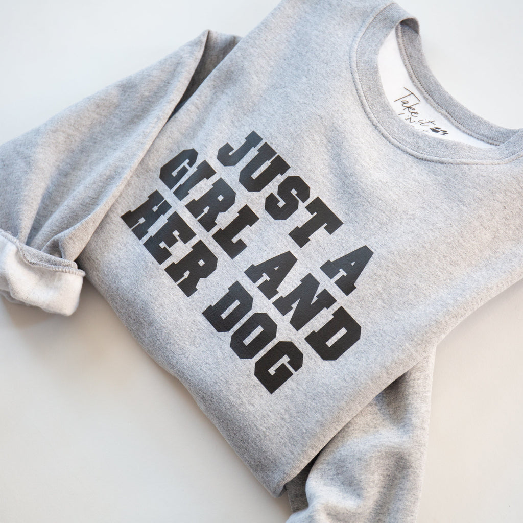 Gray sweatshirt with 'Just a Girl and Her Dog' text on a white background