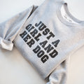 Gray sweatshirt with 'Just a Girl and Her Dog' text on a white background