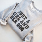 Gray sweatshirt with 'Just a Girl and Her Dog' text on a white background