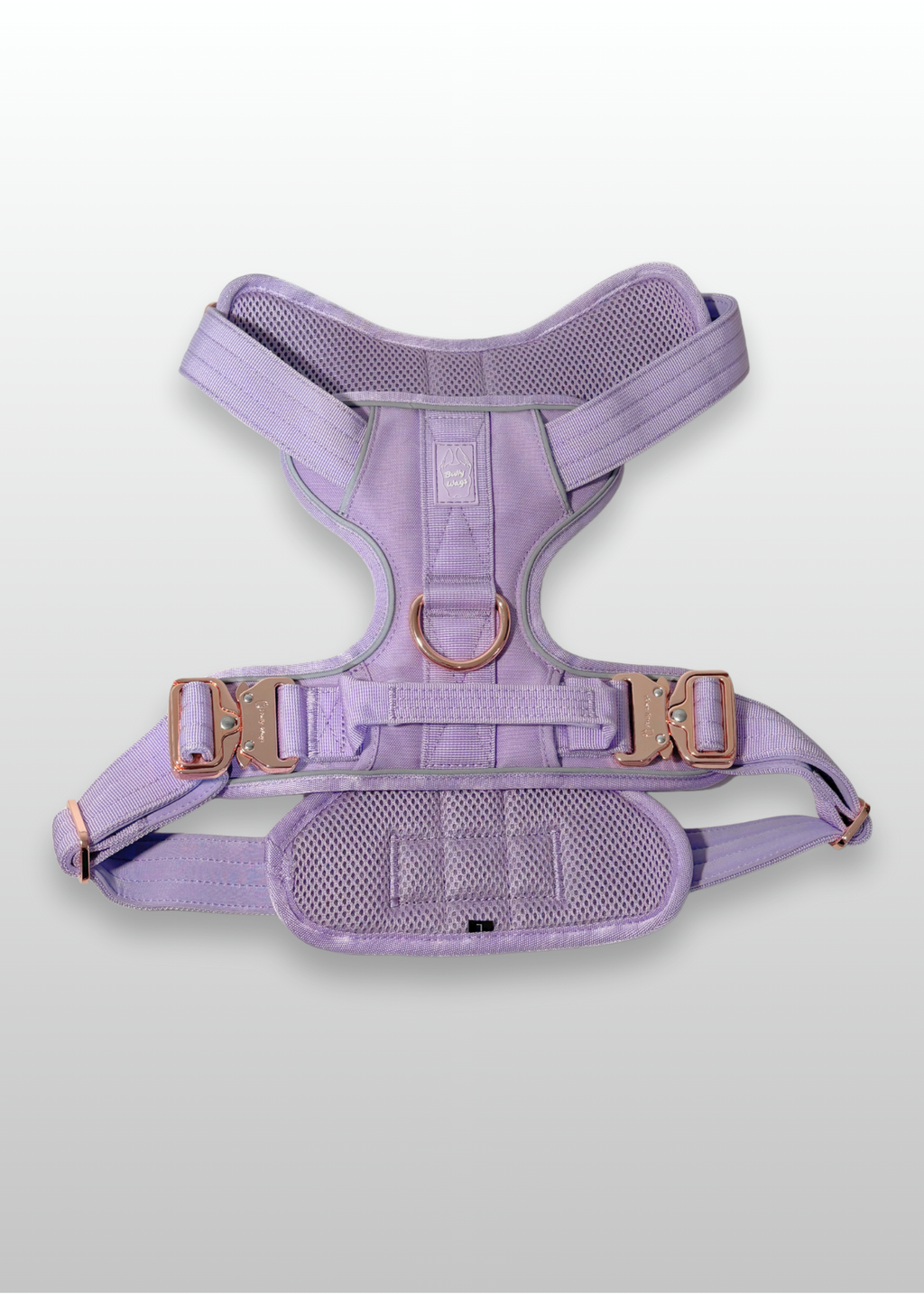 Lilac dog harness with gold hardware on a light gray background