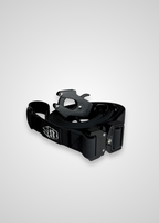 Black dog leash with metal frog clip on a light gray background