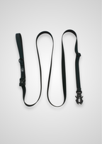 Black dog leash with metal frog clip on a white background