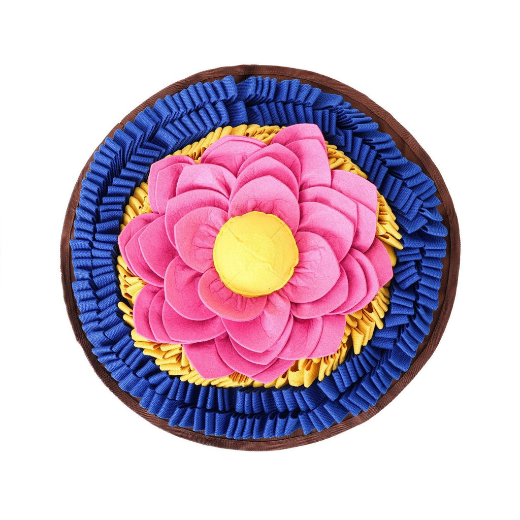 Pink lotus flower on a blue and yellow snuffle mat on a white background