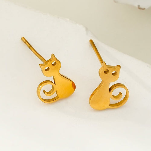 Gold cat-shaped earrings on a white background