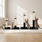 Set of cat scratching posts with height indicators in a room with light wood flooring and a window.