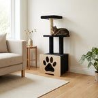 Cat sitting on a black and wooden cat tree in a living room.