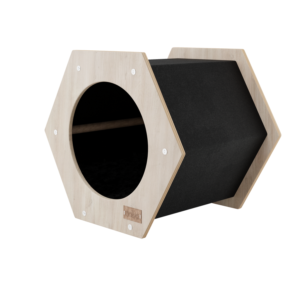 Hexagonal wooden pet bed with black interior on a white background