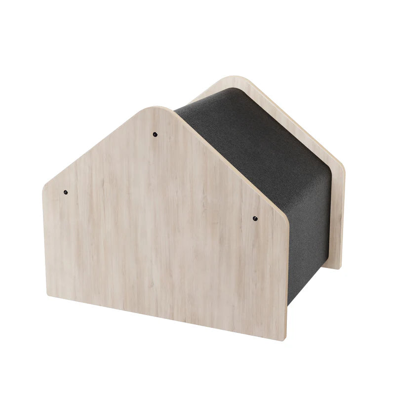 Wooden pet house with a black cushion on a white background