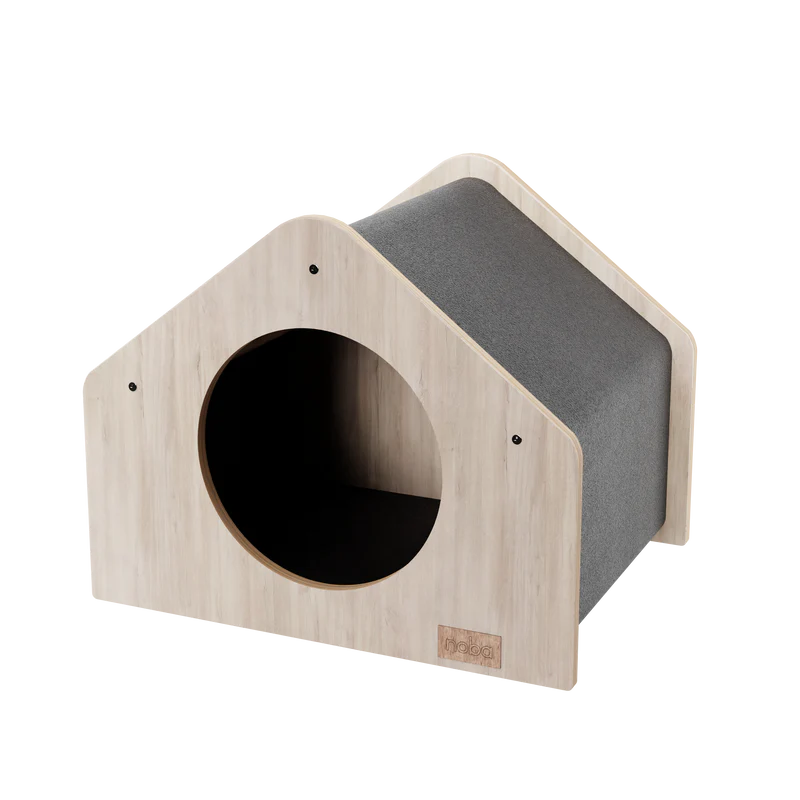 Wooden pet house with a gray cushion on a white background