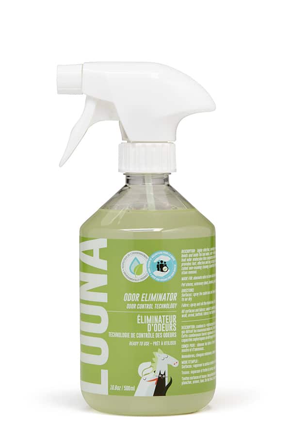 Green spray bottle with a white nozzle on a white background
