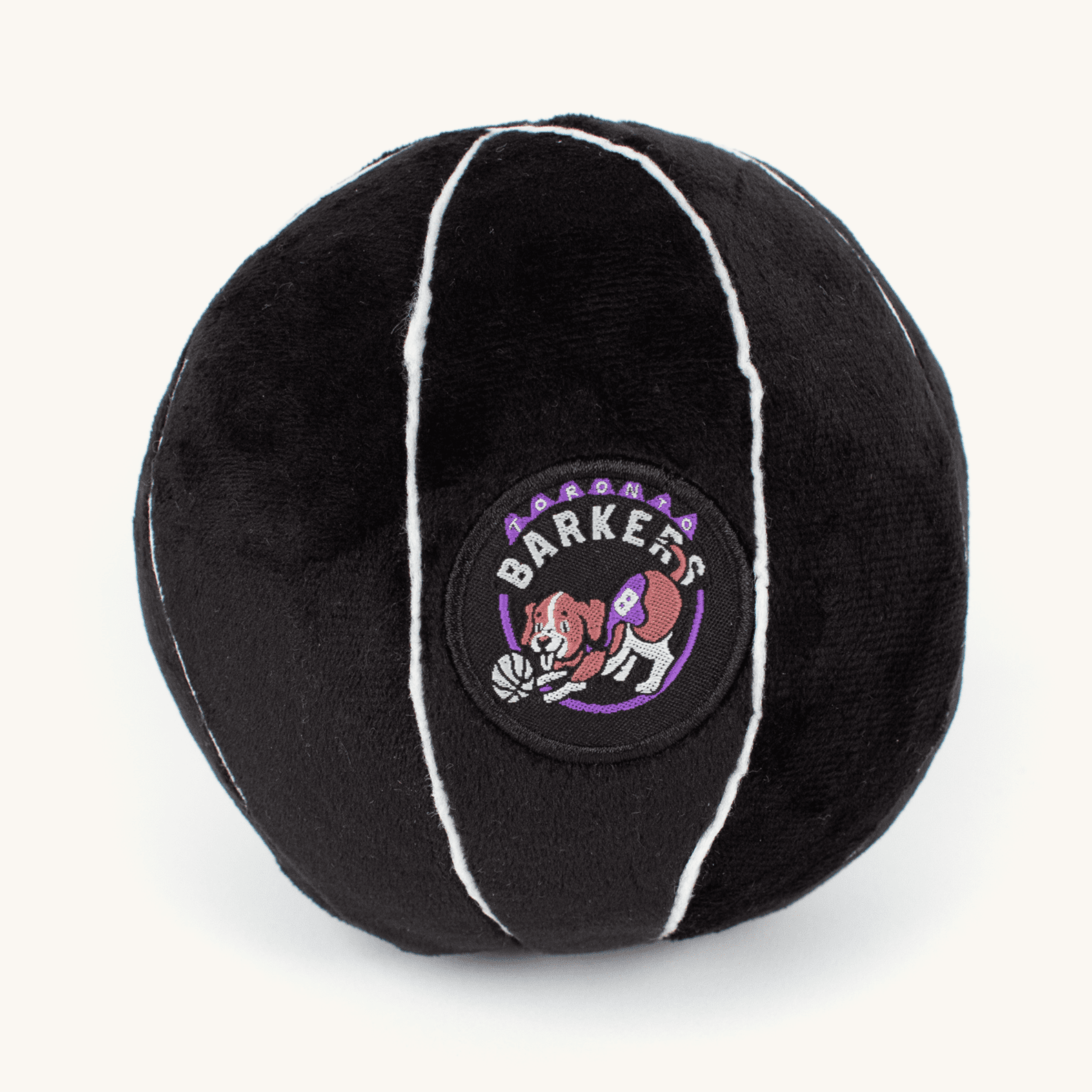 Black plush ball with white trim featuring a logo on a white background