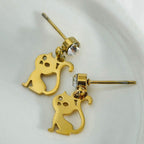 Gold cat-shaped earrings on a white background