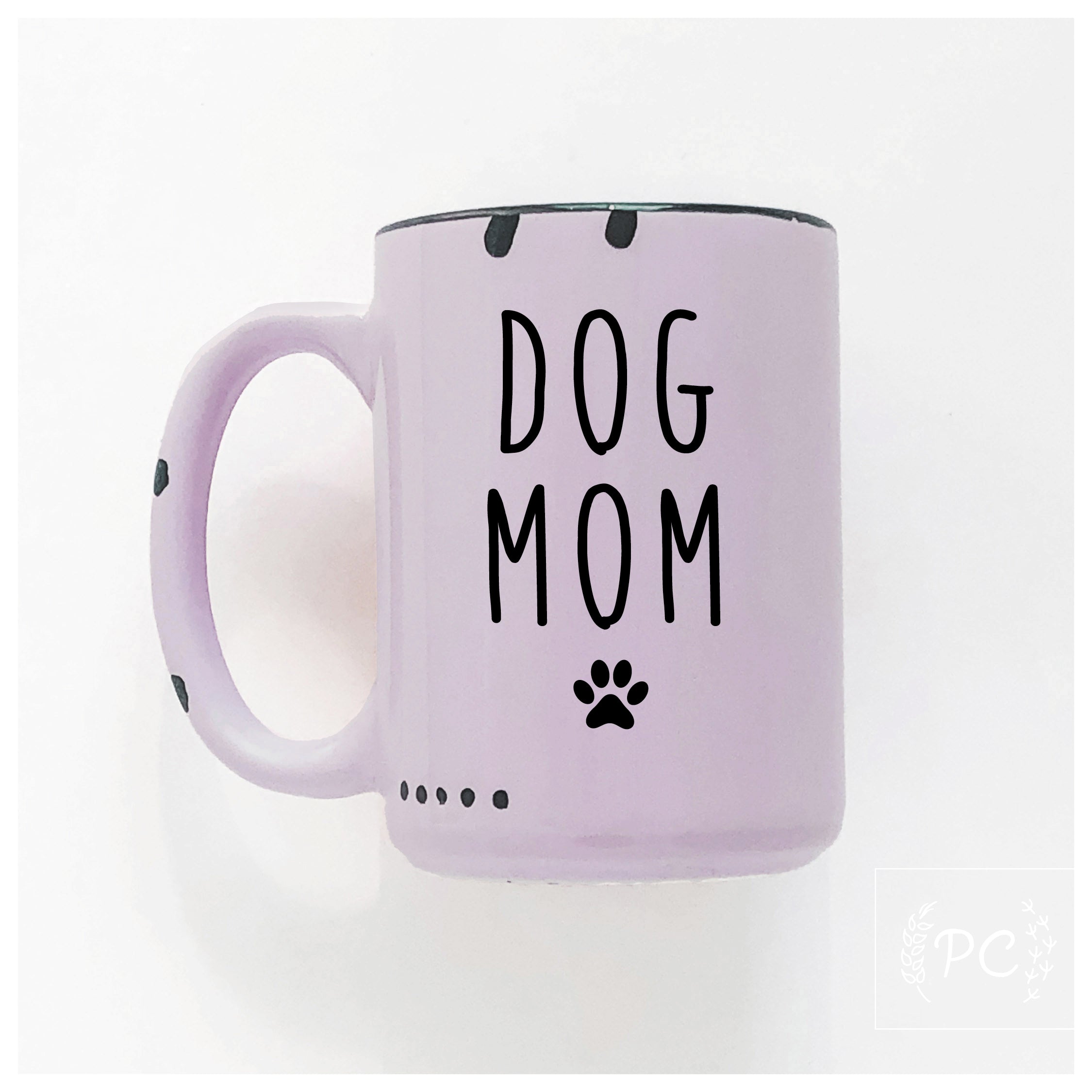 Pink mug with 'DOG MOM' text and paw print on a white background