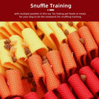 Dog toy with multiple pockets for snuffle training, featuring red, orange, and yellow colors.