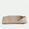 Beige pet bed on a white background