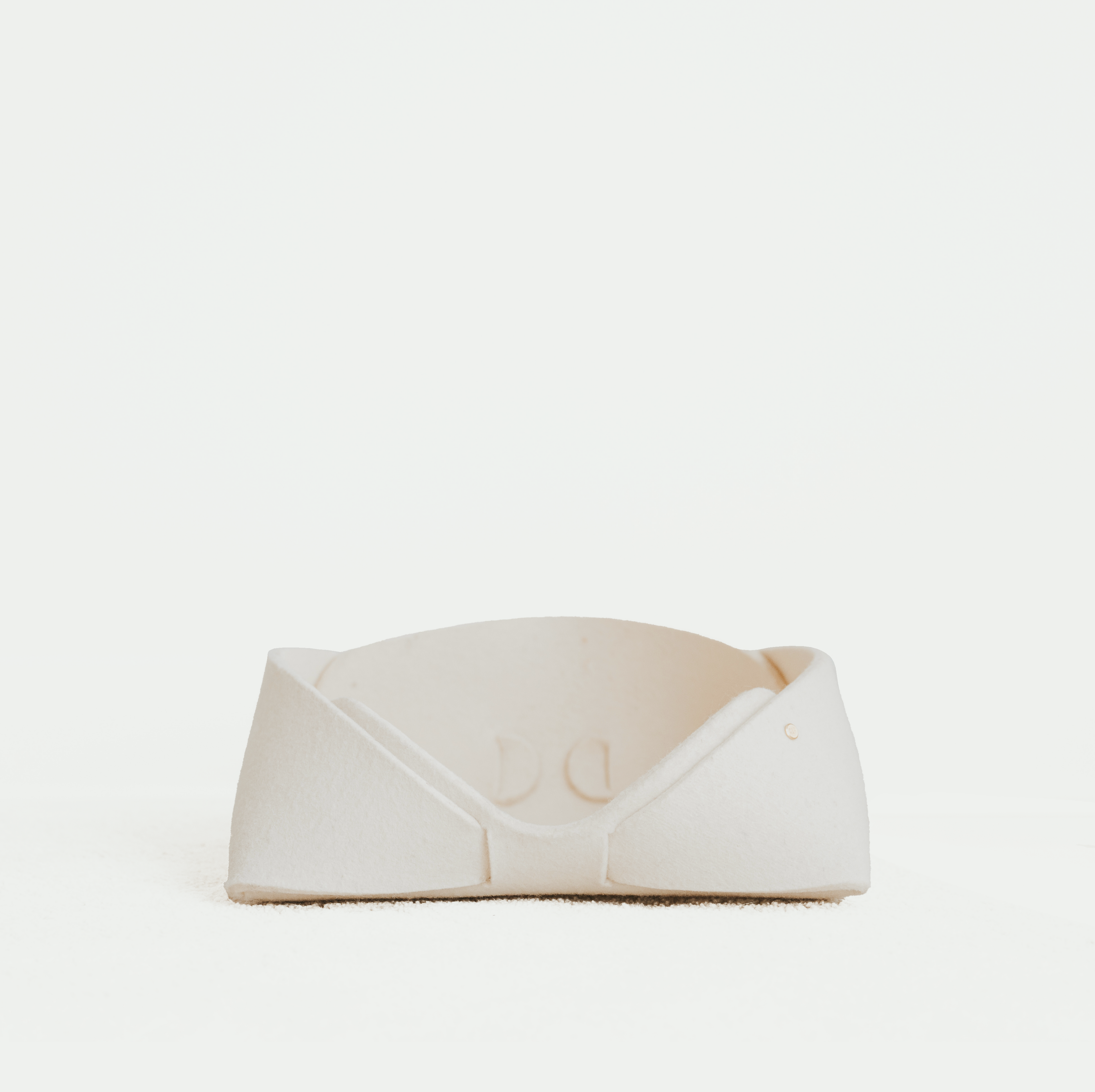 White pet bed on a white background