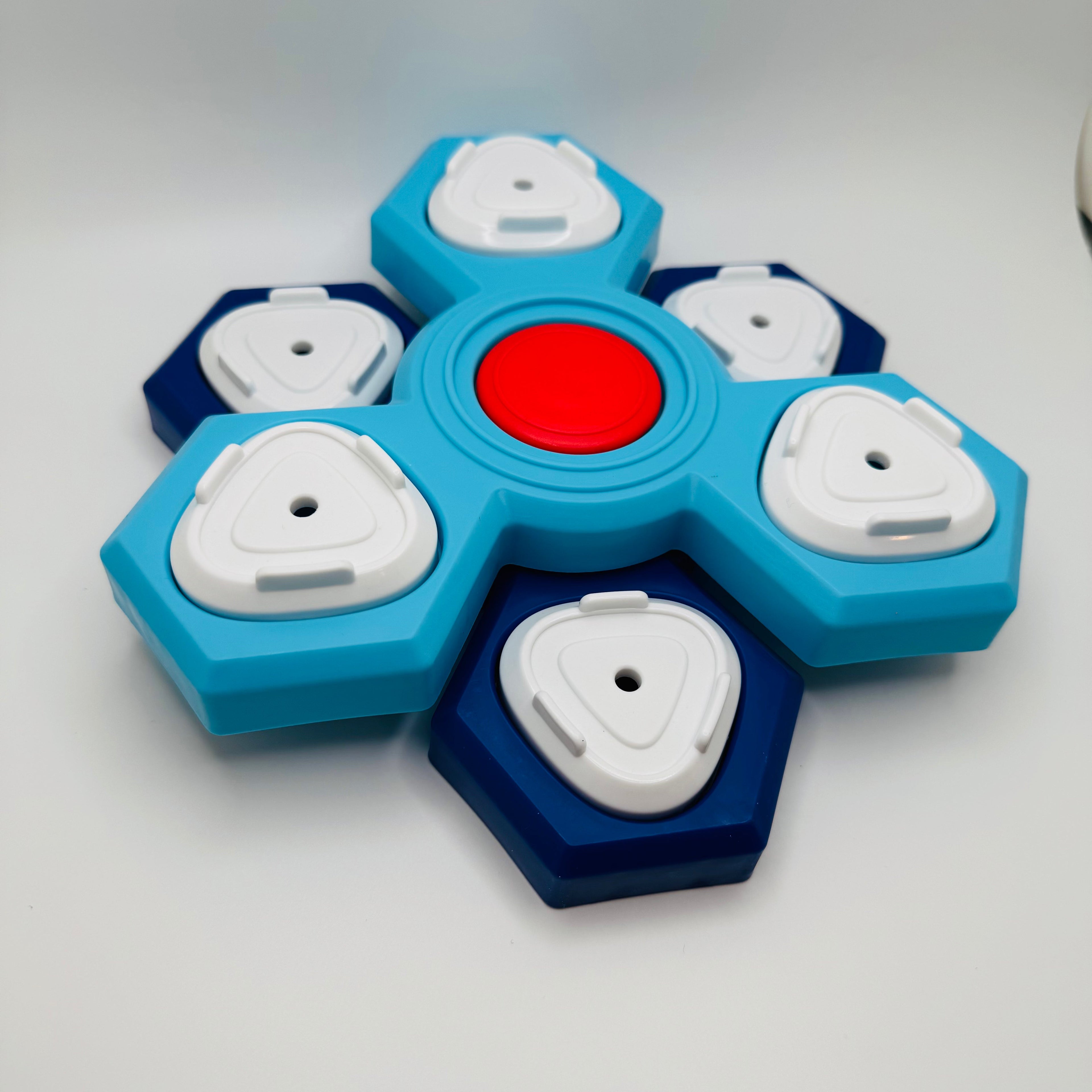 Blue and white dog puzzle with a red center on a light gray background