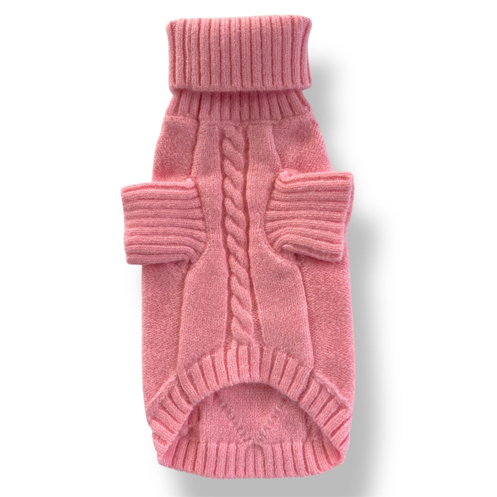 Pink knitted dog sweater on a white background