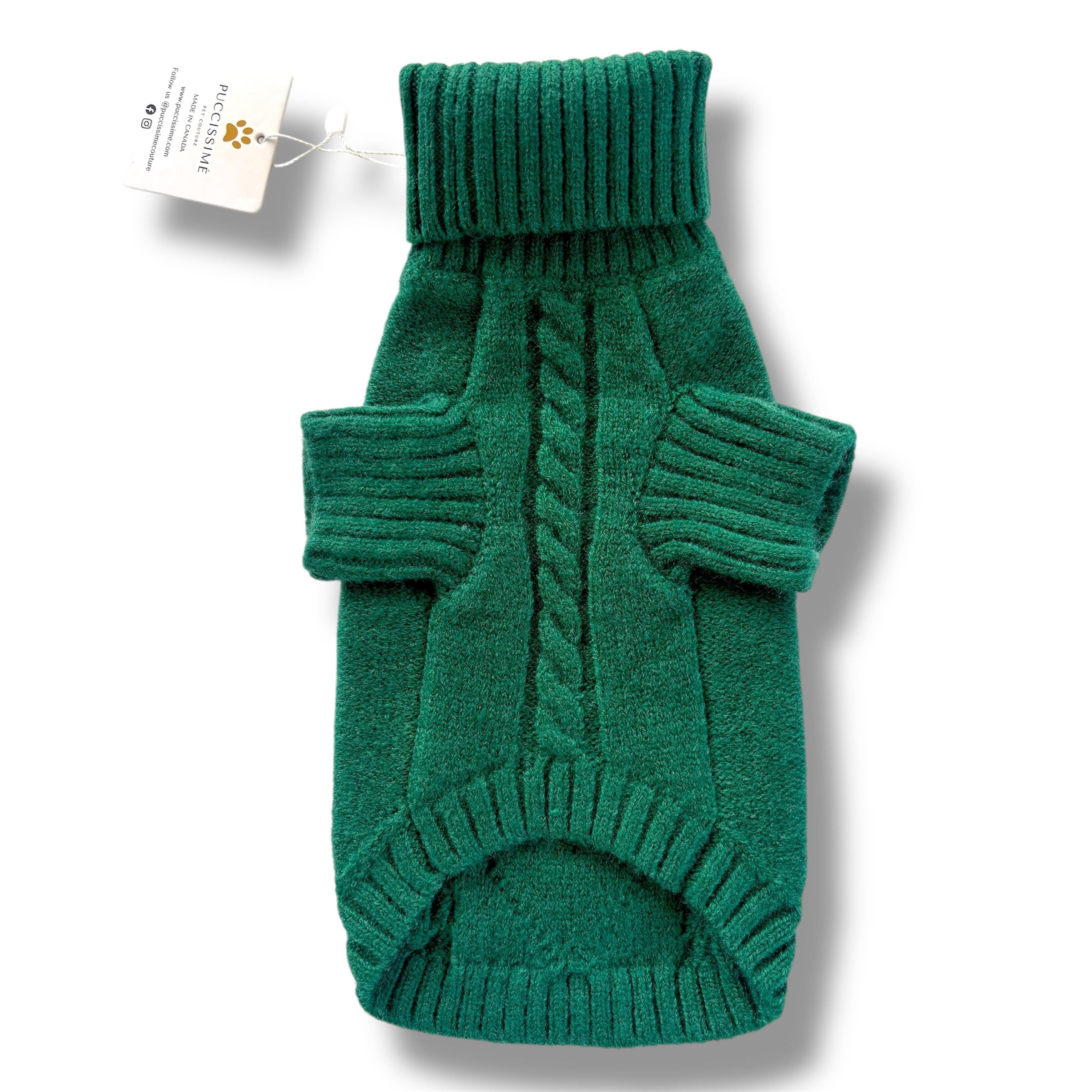 Green knitted dog sweater with a tag on a white background