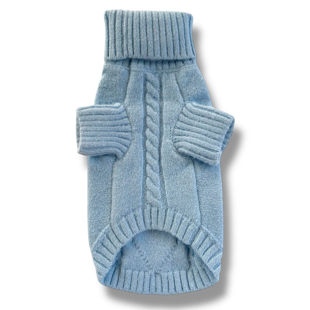 Blue knitted dog sweater on a white background